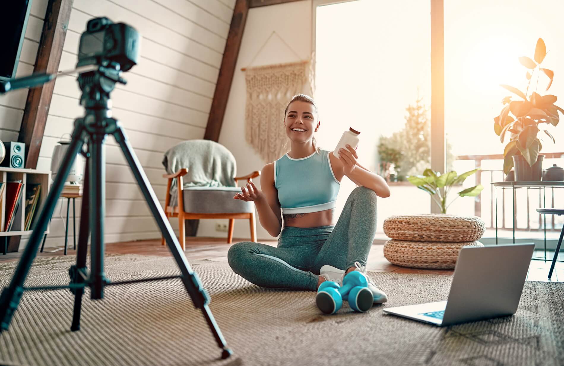 A sports influencer recording a video at home